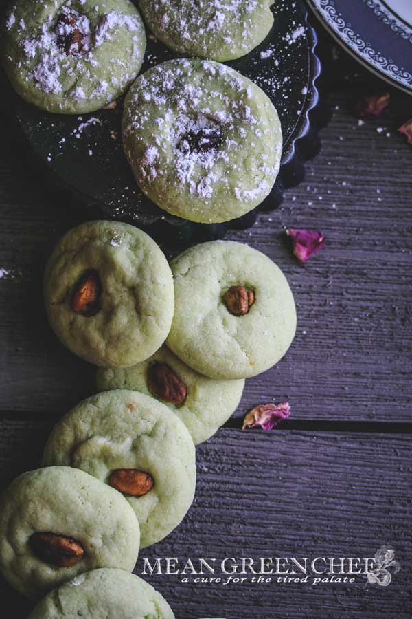 Overhead photo of green Pistachio Pudding Cookies on gray wooden background.