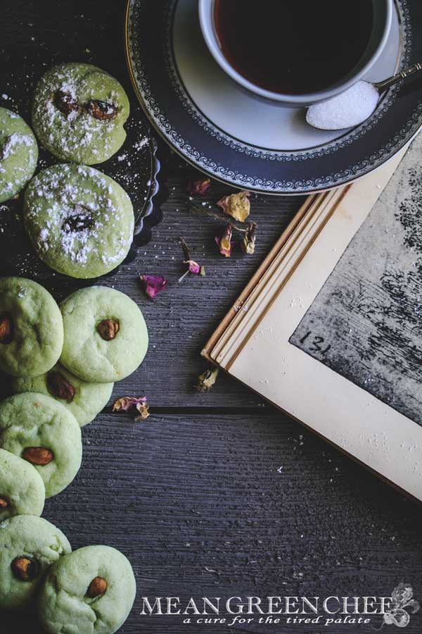Photo of green Pistachio Pudding Cookies on gray wooden background.