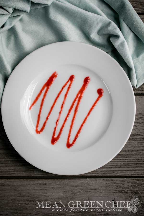 Fruit Coulis zig zag pattern on a white plate.