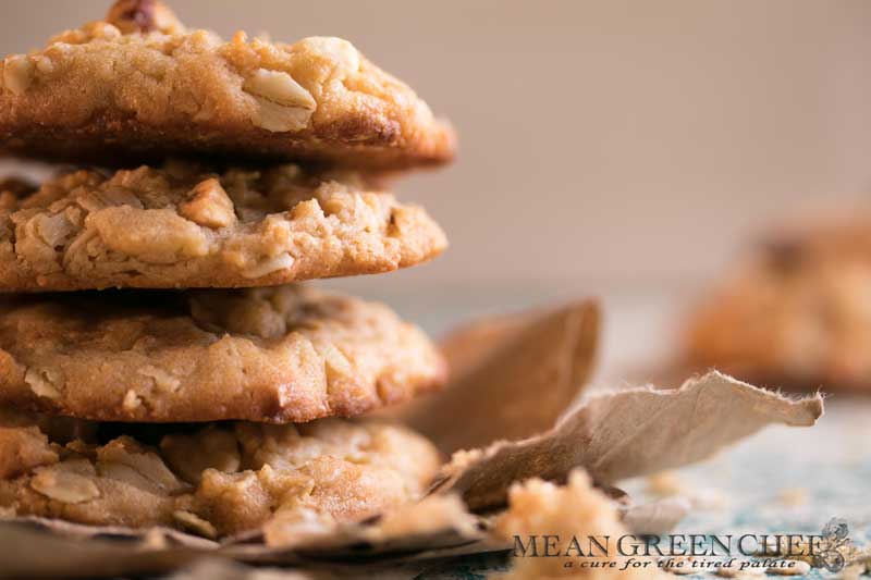 Stacked Peanut Butter Oatmeal Cookies pictured with brown sugar.