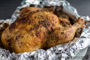 Roasted whole chicken sitting in foil for Mexican Tortilla Chicken Soup