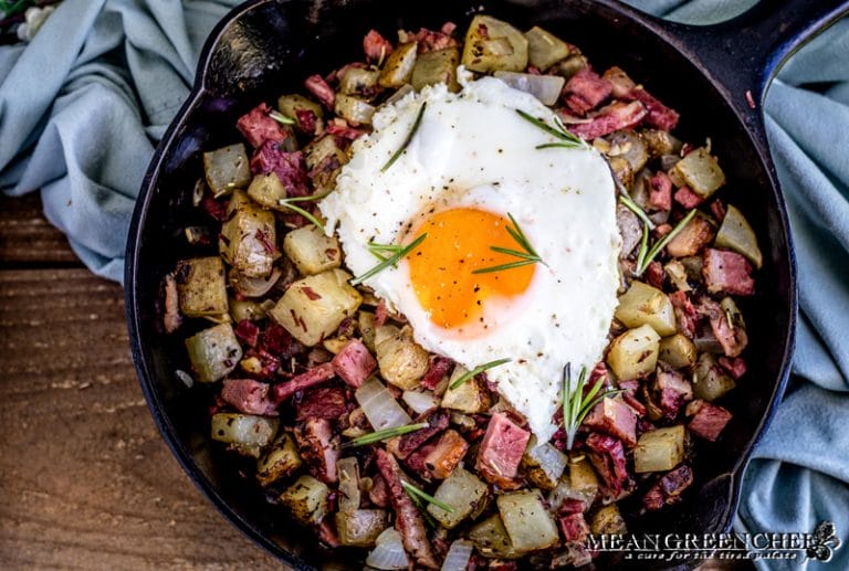 Overhead shot of Restaurant Style Corned Beef Hash topped with a sunny side up eggs