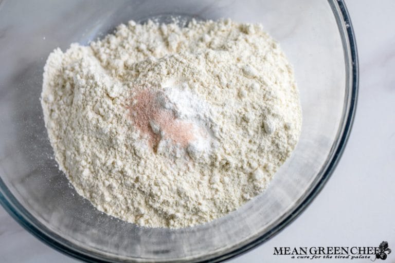 Flour, baking powder and pink Himalayan sea salt being mixed for Orange Cranberry Cookies.