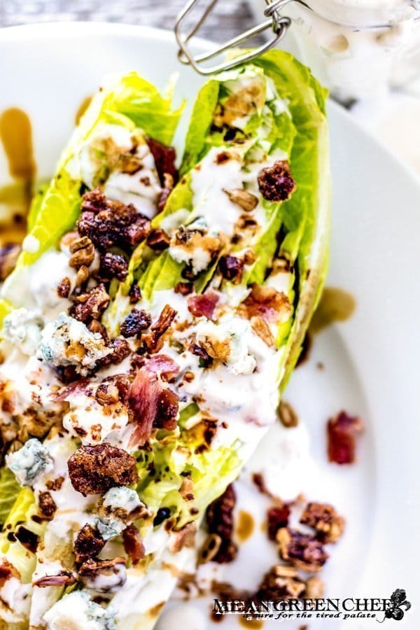 Buttermilk Blue Cheese Dressing poured over a Romaine Wedge Salad with bacon and balsamic vinaigrette.