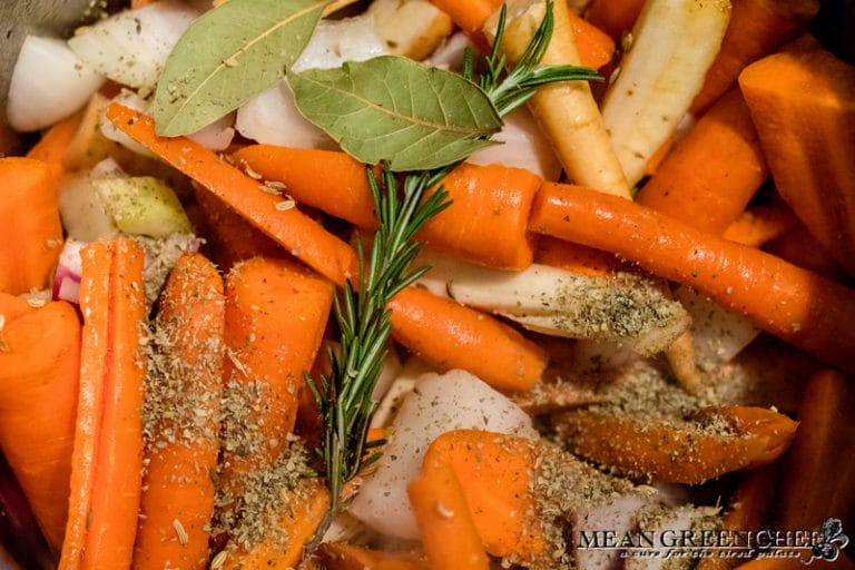 Vegetables + herbs in the Instant Pot for Red Wine Pot Roast.