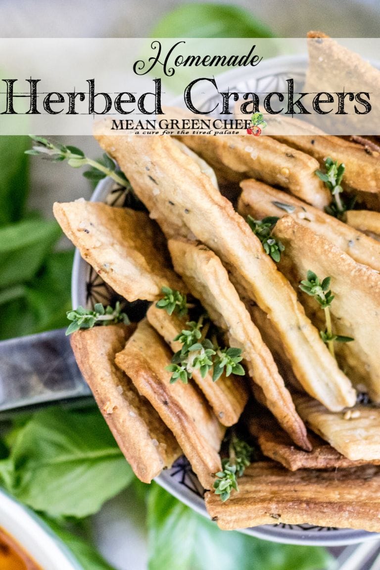 Herbed crackers in a grey mug garnished with fresh thyme.