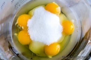 Eggs, egg yolks, and sugar to make custard for flan.