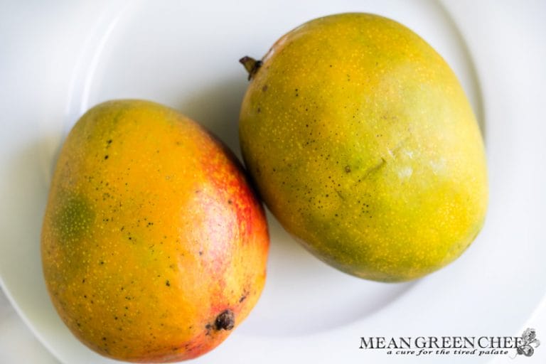 Ripe Mangoes on a white plate.