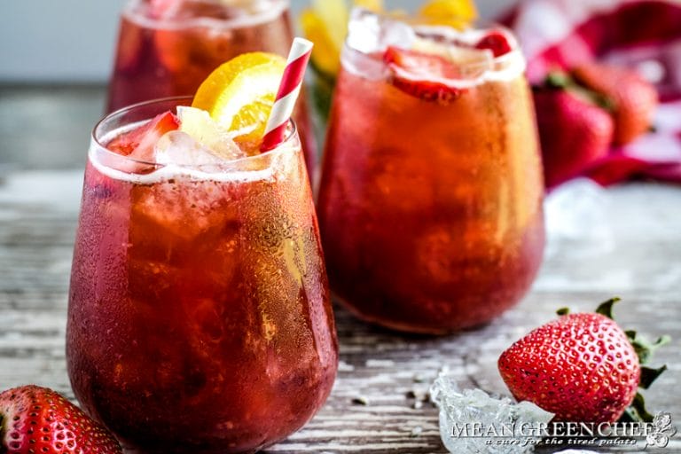 Glasses of Strawberry Iced Tea with condensation on the outside of the glasses.