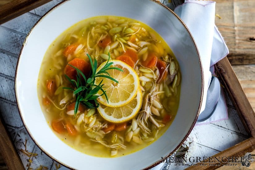 Lemon Chicken Orzo Soup on a wooden background