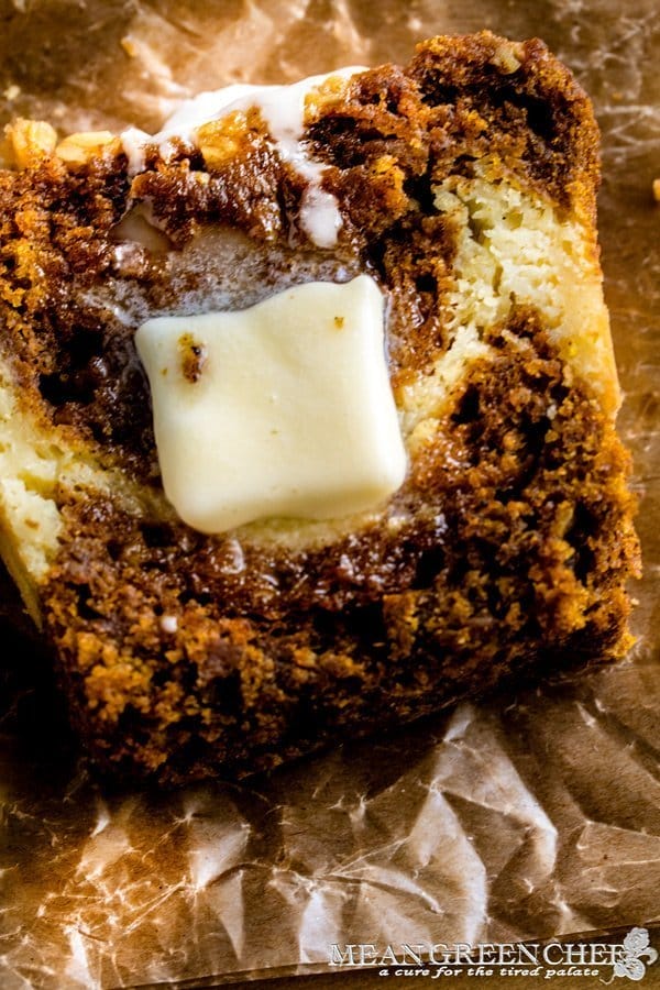 Slice of Pumpkin Bread with butter melting on it.