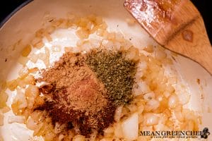 Spices added to Dutch oven for Pumpkin Chicken Chili