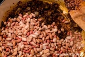 Beans being added to Roasted Pumpkin Chicken Chili