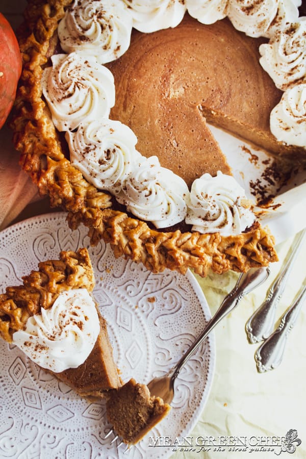 Punch of Pumpkin Pie garnished with vanilla bean whipped cream on a white plate.
