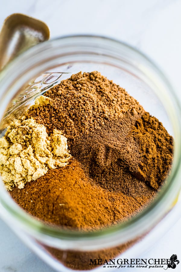 Ingredients for homemade pumpkin pie spice in a jar.