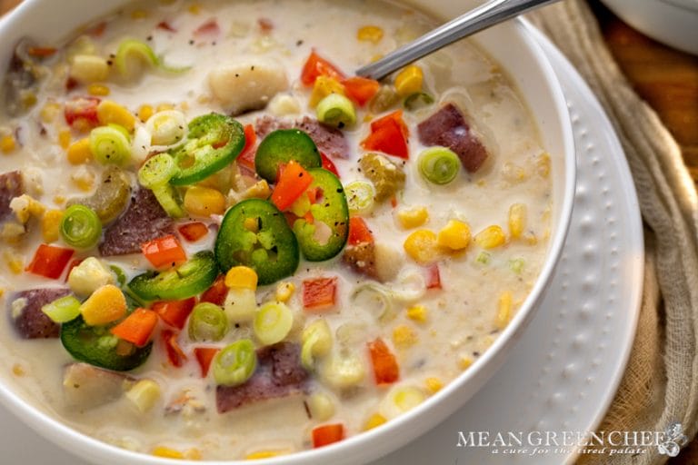 Sweet Corn Chowder in a classic white bowl on a wooden background