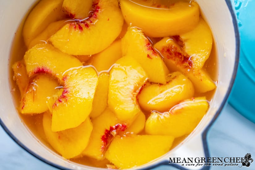 Fresh peaches ready to be cooked down to make peach simple syrup.